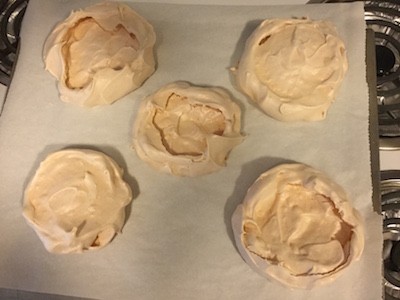 mango pavlova in the oven