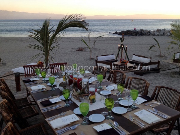tables set up on the beach for wedding dinner in Sayulilta